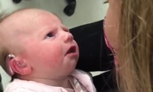 Emotional moment deaf baby hears mom's voice for the first time
