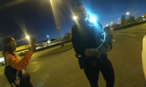 Police rescue kitten stuck under car hood