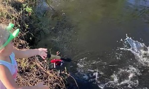 Daughter Reeling in First Fish Drops Pole