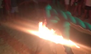 Man Jumping Rope on Fire at Full Moon Party Fails