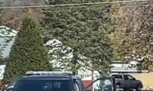 Woman Seen Getting into Driver's Seat of Law Enforcement Vehicle