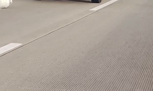 Truck Driving on Interstate Dragging a Propane Tank