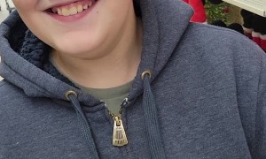 Son Struggles to Read Christmas Decoration