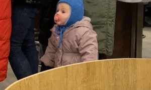 Kid Kept Close with Winter Leash