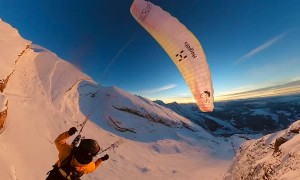 Paraglider Flies and Skis Over Golden Hour Mountains
