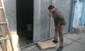 Man Attempts to Carry Sack of Cement Up Ladder