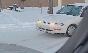 Car Crosses Despite Missing One Wheel