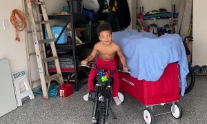 Son Listening to Dad is Oblivious to Dirt Bike Christmas Present