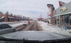 Woman Attacks a Car in Traffic in Denver