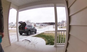 Man Loading Car Slips on Ice in Hard Fall