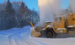 Old SnoGo Truck Launching Snow High into the Air