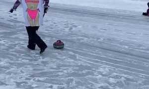 Curling Player Takes Hard Fall on Ice