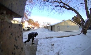 Man Slips and Falls on Icy Walkway