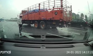 Motorcyclist Nearly Run Over After Crashing on Highway