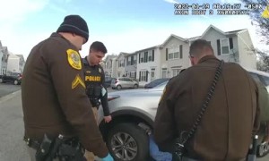 Police lift SUV to rescue a woman trapped underneath it