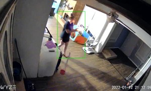 Woman Panics as She Holds onto Burning Object