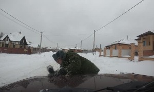 Skitching Snowboarder Veers into Wrong Lane