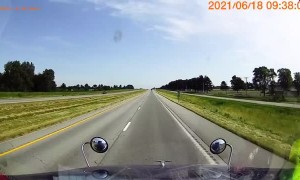 Driver on Wrong Side of the Road Almost Hit by Semi