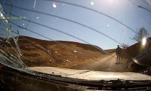 Driver Collides with Cyclist on Narrow Road