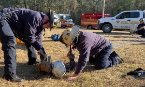 Firefighters rescue stranded dog at the bottom of a deep hole