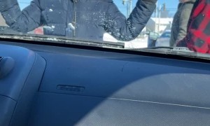 Anti-Convoy Protestor Blocks Car