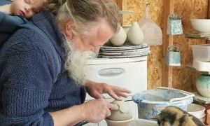 Cat Plays With Pottery Wheel