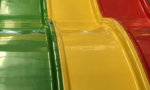 Woman and Child Take a Tumble on the Slide