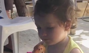 Girl Shows Bird Reflection in Tiny Mirror