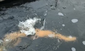 Guy Bumps Head on Ice During Frozen Lake Swim