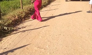 Woman Expertly Removes Snake from Road