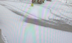 Snowplow Backs Into Light Pole