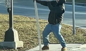 Guy at Stoplight Shares Opinion of Vladimir Putin on Sign