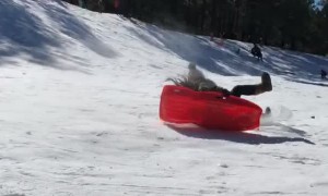 Woman Sledding Loses Control and Hits Ice Block