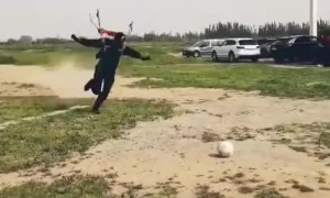 Skydiver Lands and Kicks Soccer Ball