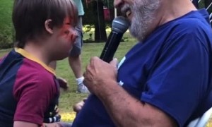 Grandpa sweetly serenades happy little kid