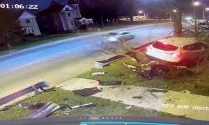 Out of Control Car Lands on Tree in Front Yard