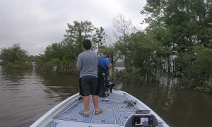 Father Hooks Son's Hat while Fishing