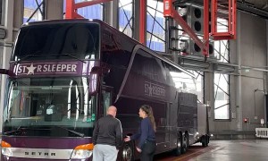 Bus and Trailer Being Turned Around by Large Lift