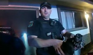 Police officers rescue litter of puppies from house fire
