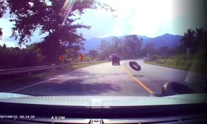 Precariously Stacked Tires Fall Off Truck