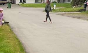 Little Girl Learning to Ride a Bike
