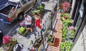 Pedestrians Play Hopscotch on Sidewalk