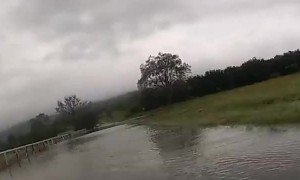 Police rescue men and their dogs from rising floodwaters