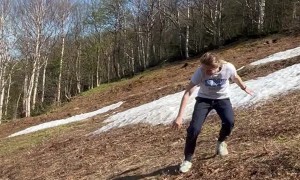 Kid Trips and Tumbles Down Hill