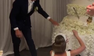 Groom Smashes Cake in Bride's Face