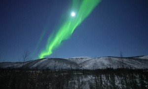 Auroras Dancing Under a Full Moon