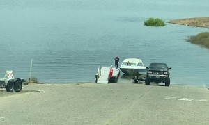 Driver Struggles to Back Boat Trailer into the Lake