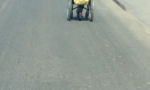 Man in Wheelchair Uses Electric Scooter to Commute