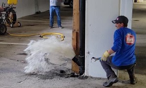 Opening a Sewer Pipe Inside a Garage