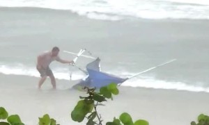 Lightning Strikes Near Men After Catching Runaway Shelter